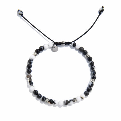 Top view of handmade zebra jasper bracelet featuring natural black and white gemstone beads with silver accents.