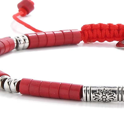 Close-up of mens red bracelet with red clay discs and silver barrel accents