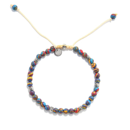 Handmade multicolored gemstone bracelet with vibrant blue, red, and yellow beads paired with silver decorative spacers.