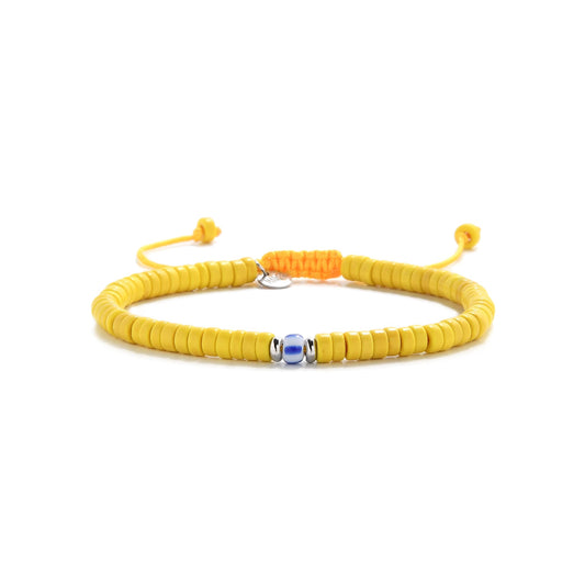 Frontal view of handmade yellow beads bracelet with silver and blue details on white background