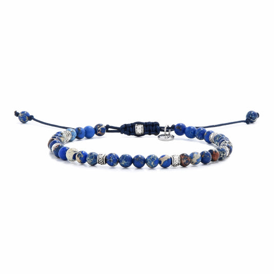 jasper stone bracelet laid flat with a mix of deep blue and earthy tones on strong cord