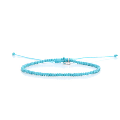A minimalist light blue bracelet from our mens beaded bracelets collection laid horizontally to show its full length and design.