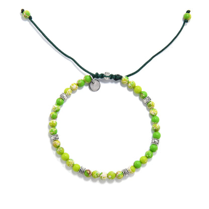 Handmade Light Green Stone Bracelet with metal accents.