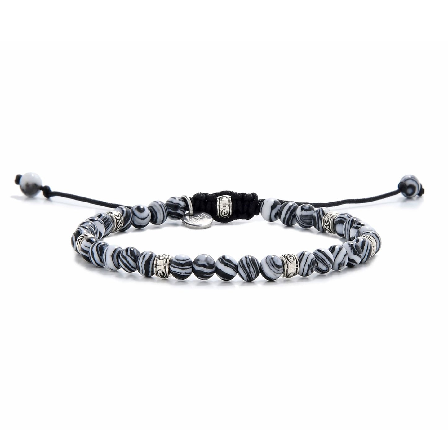 Full view of malachite bracelet featuring striped black and white beads with silver spacers.