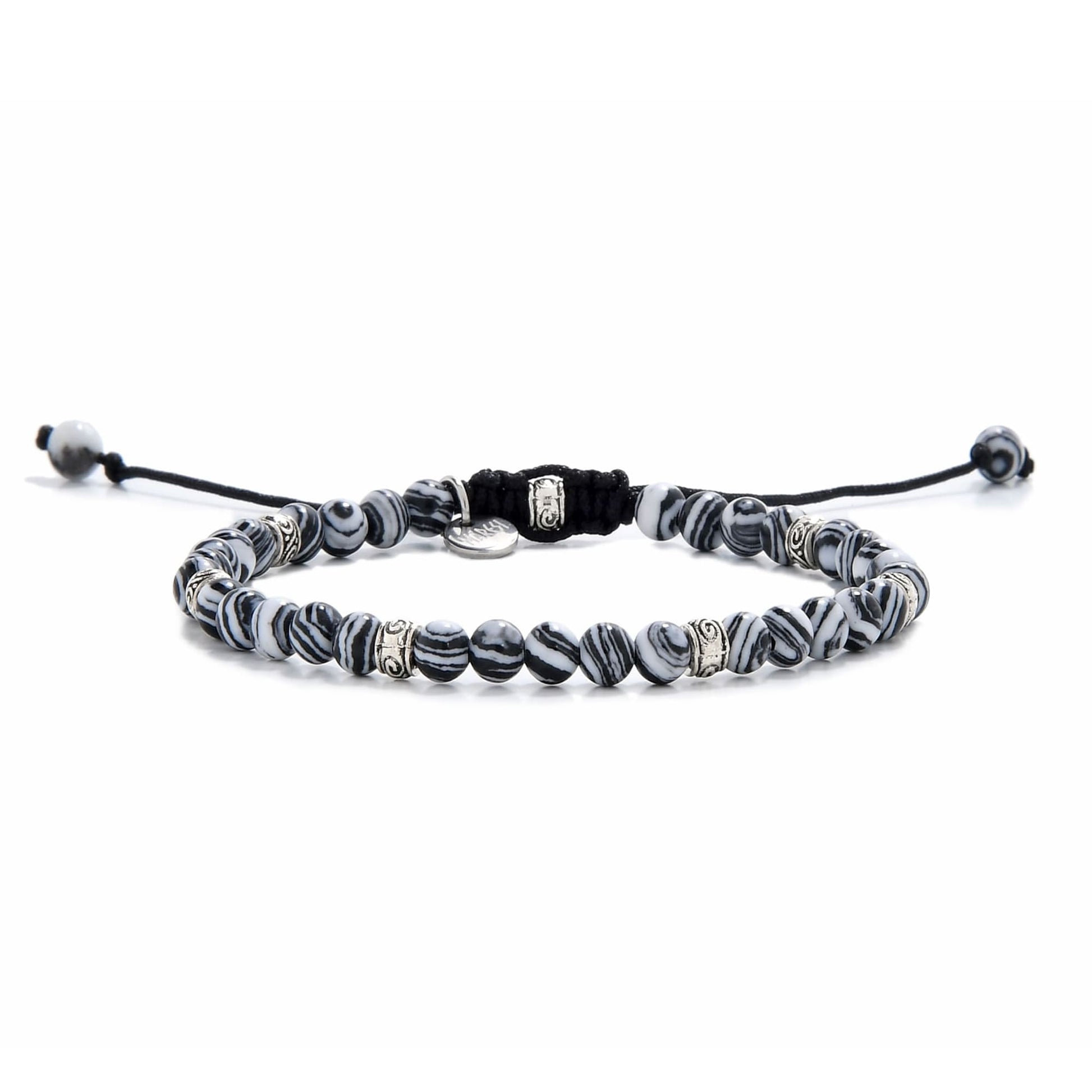 Full view of malachite bracelet featuring striped black and white beads with silver spacers.