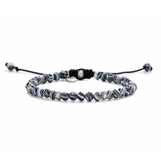 Full view of malachite bracelet featuring striped black and white beads with silver spacers.