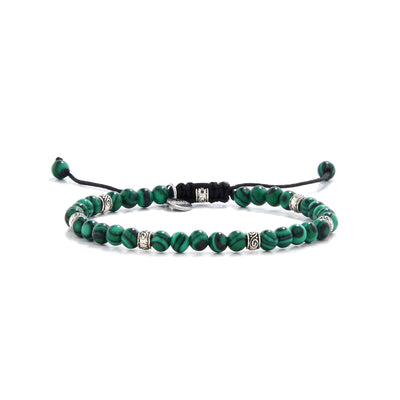 Elegant Malachite jewelry bracelet featuring green beads and silver spacers.