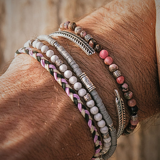 Close-up of Mallorca couples bracelet set featuring pink, silver, and white beads with silver detailing.