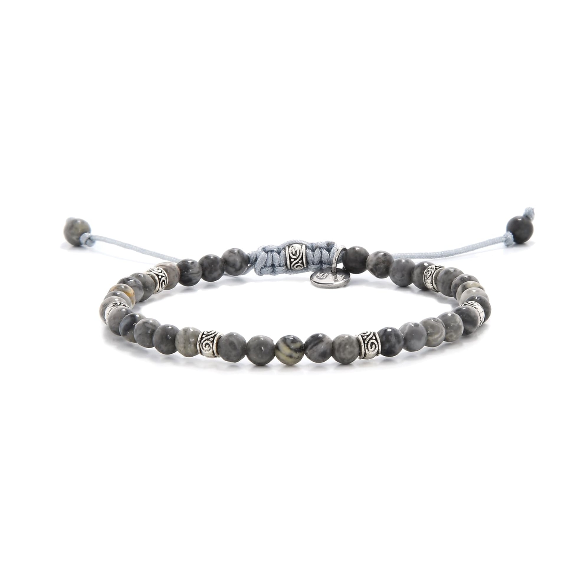 Gray jasper bracelet with silver accents and adjustable cord, styled on white background