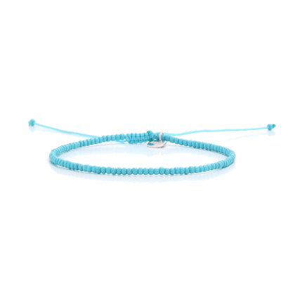 A minimalist light blue bracelet from our mens beaded bracelets collection laid horizontally