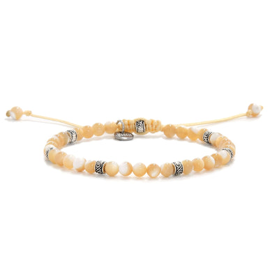 Elegant Mother of Pearl bracelet with silver beads on yellow cord.