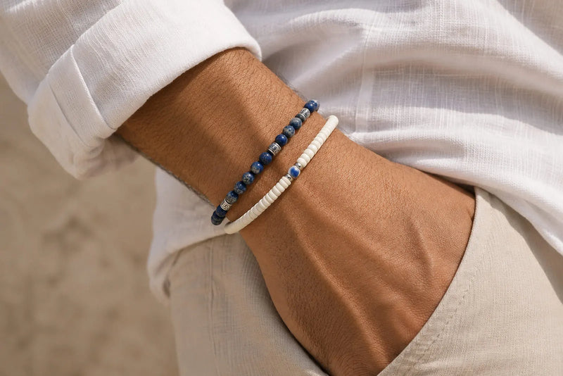 Navy blue and white bracelet color combo worn together with a white linen shirt