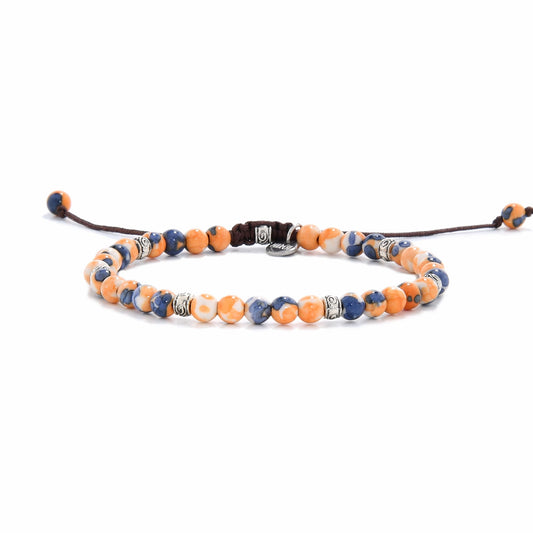 front angle of Orange Flower Jasper bracelet showing full beaded design with brown adjustable cord and metal-tone spacers