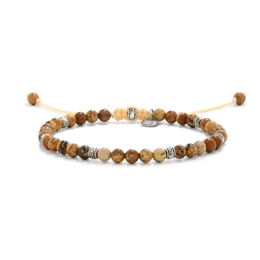 Picture jasper rock bracelet displayed with beige cord and metal spacers

