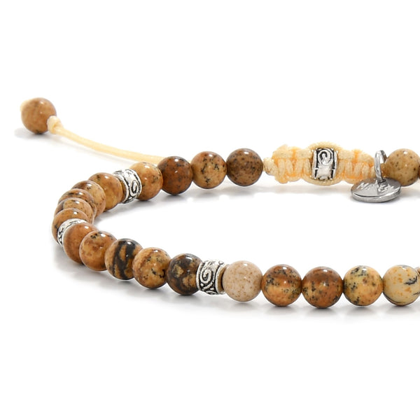 Close-up of Picture Jasper stone bracelet showing detailed bead patterns.