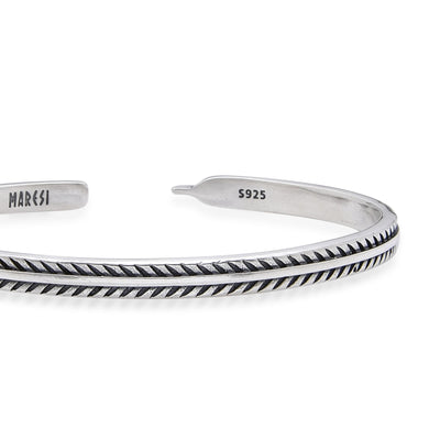 Detailed close-up of silver mens bracelet highlighting its textured design