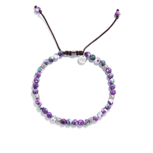 Handmade purple jasper bracelet with green and white accents on brown cord.