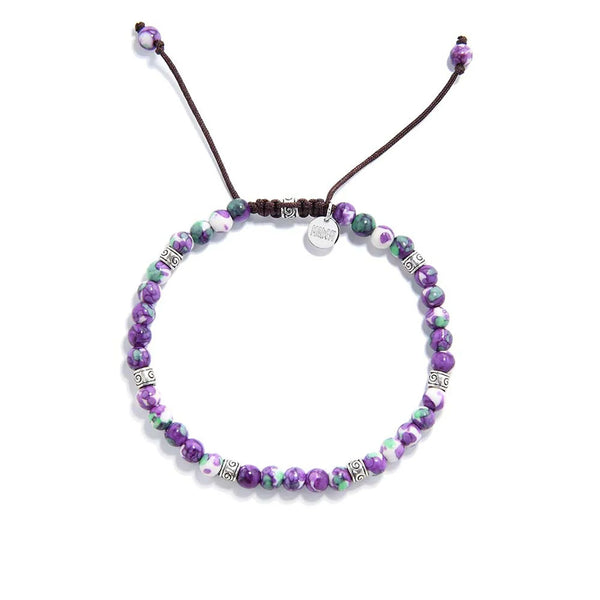 Handmade purple jasper bracelet with green and white accents on brown cord.
