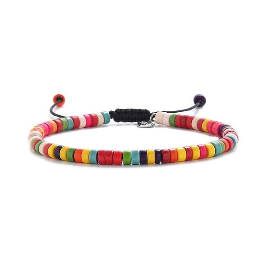 Adjustable bracelet with colorful beads strung on black cord, showing full round shape