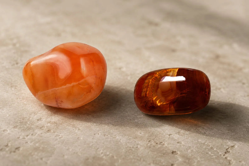 Orange and brown-red polished stones illustrating carnelian and sard.
