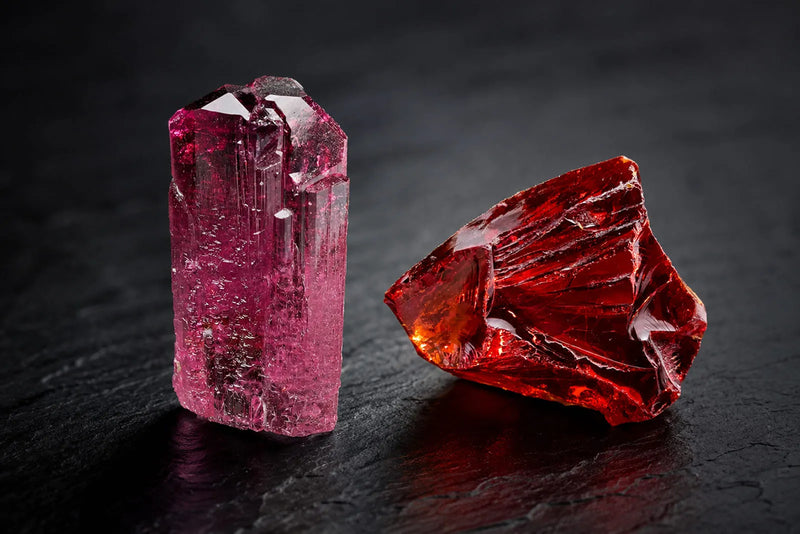 Pink-red prismatic crystal and deep-red rough stone illustrating rubellite tourmaline and red zircon.
