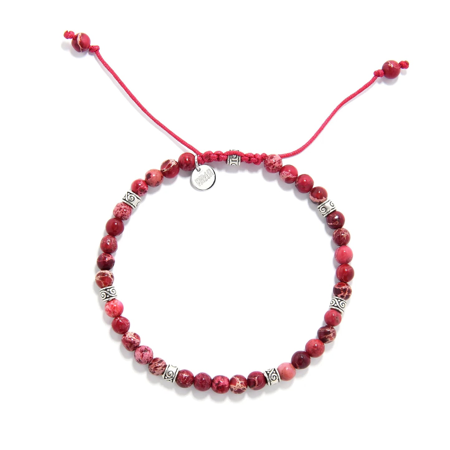 Red stone bracelet top view with round red beads, silver spacers, red cord, and charm.