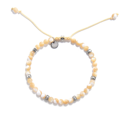 Adjustable Mother of Pearl bracelet featuring round polished beads.