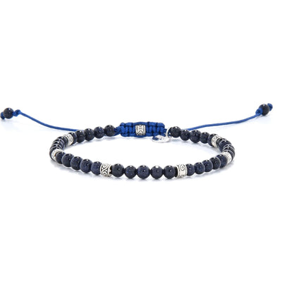 Sandstone Bracelet full angled view with dark blue beads, silver spacers, and blue cord closure