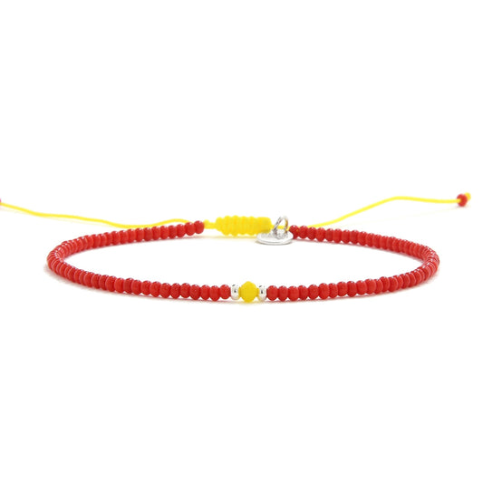 Front view of Treviso man bracelet beads in red and yellow combo
