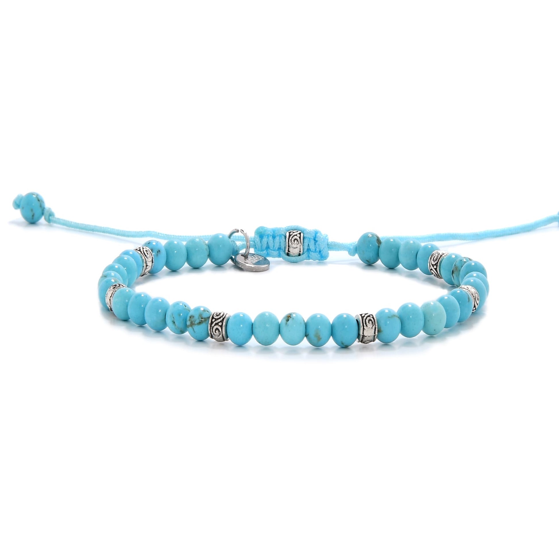 Turquoise bracelet with round beads and silver spacers, adjustable cord design