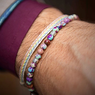 Violet sea sediment bracelet styled on wrist with casual outfit.