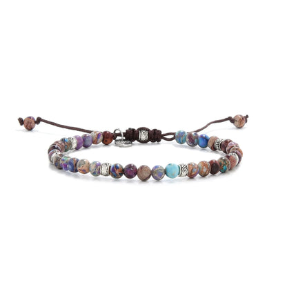 Violet sea sediment bracelet with round beads and silver accents on brown cord