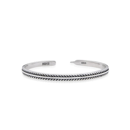 Bangles Bracelets cuff with feather-style engraving, polished open band, and stamped ends
