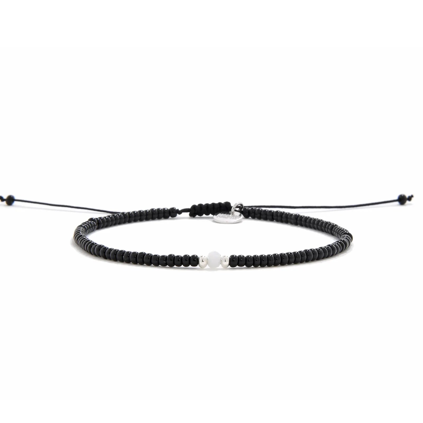 Bead Bracelet Black shown in full view with black seed beads with white accent beads and adjustable cord