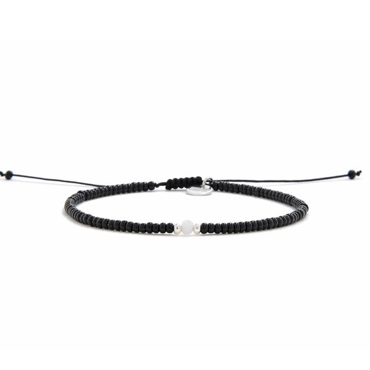 Bead Bracelet Black shown in full view with black seed beads with white accent beads and adjustable cord