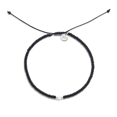 Bead Bracelet Black shown from above with black seed beads with white accent beads and round bracelet shape