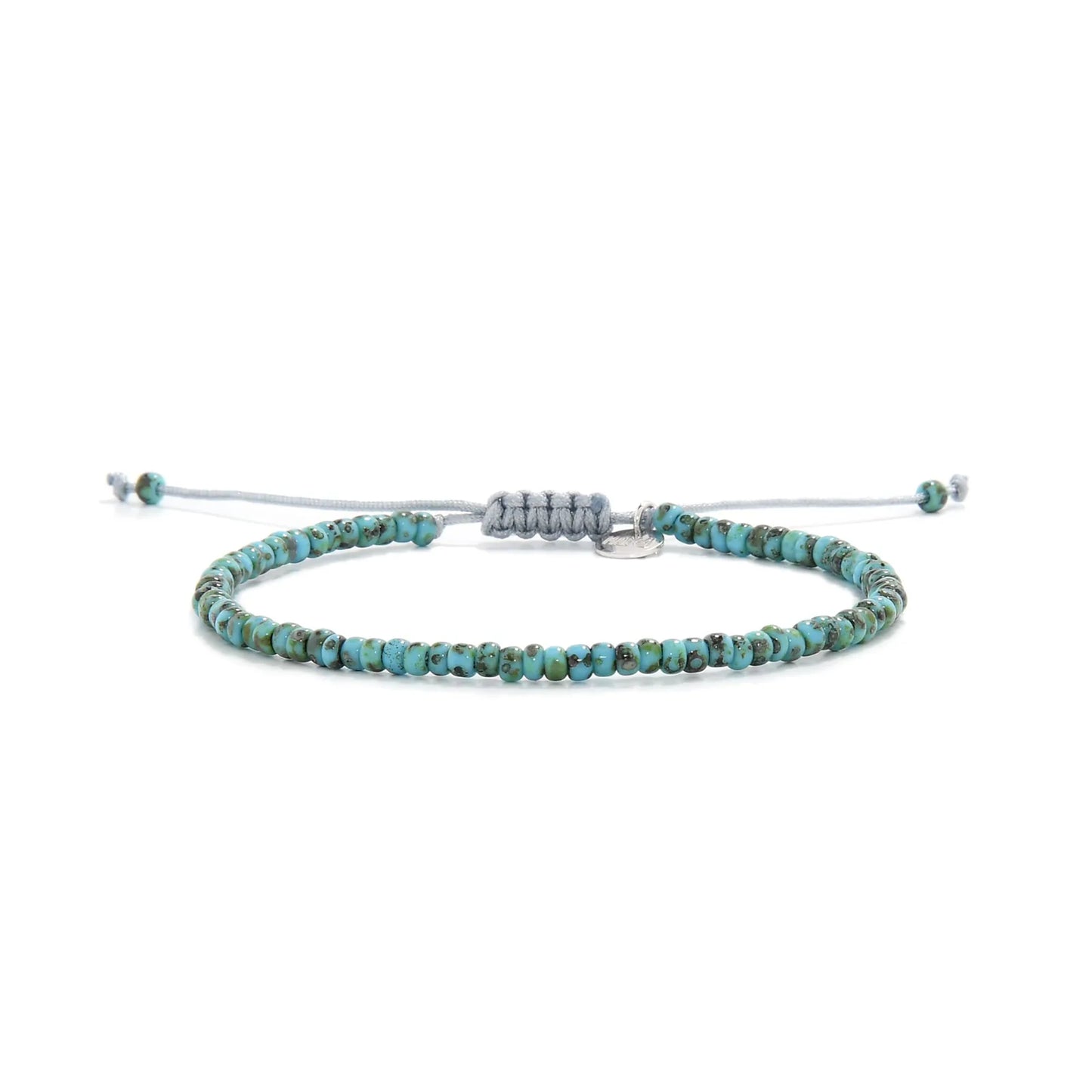 Bead Bracelet shown in full view with turquoise Picasso seed beads with gray cord and adjustable cord
