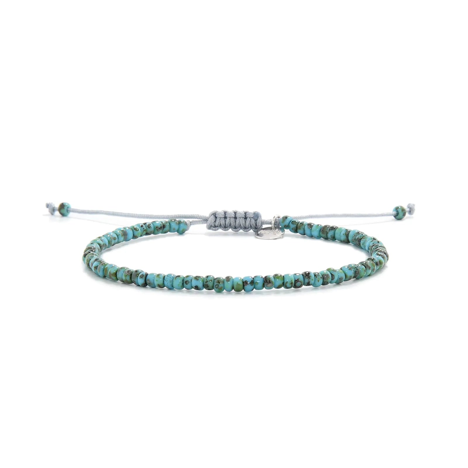 Bead Bracelet shown in full view with turquoise Picasso seed beads with gray cord and adjustable cord