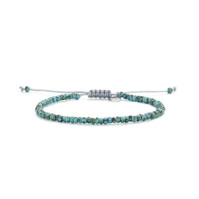Bead Bracelet shown in full view with turquoise Picasso seed beads with gray cord and adjustable cord