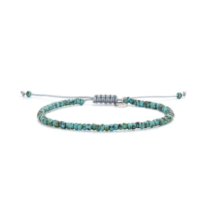 Bead Bracelet shown in full view with turquoise Picasso seed beads with gray cord and adjustable cord