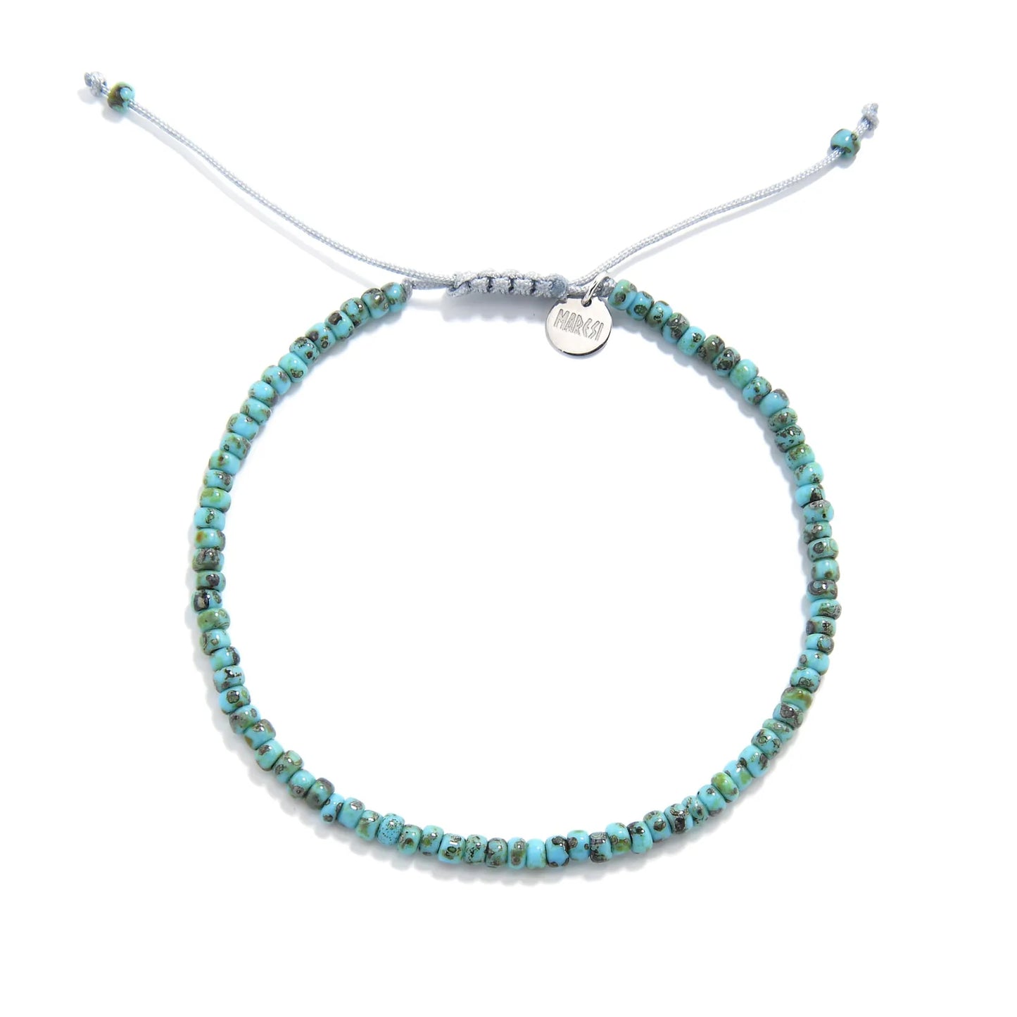 Bead Bracelet shown from above with turquoise Picasso seed beads with gray cord and round bracelet shape