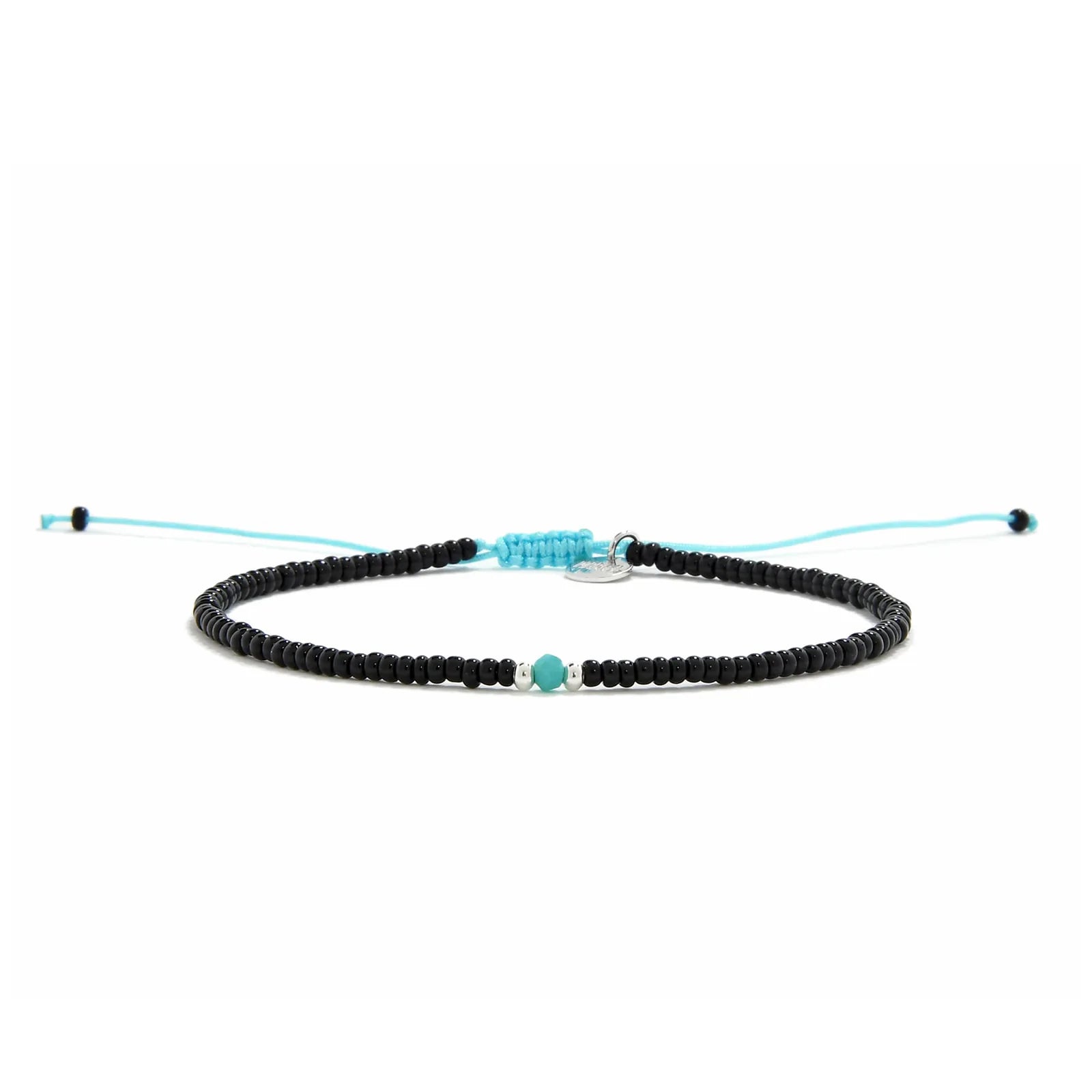 Beaded Bracelet shown in full view with black seed beads with turquoise accent beads and adjustable cord
