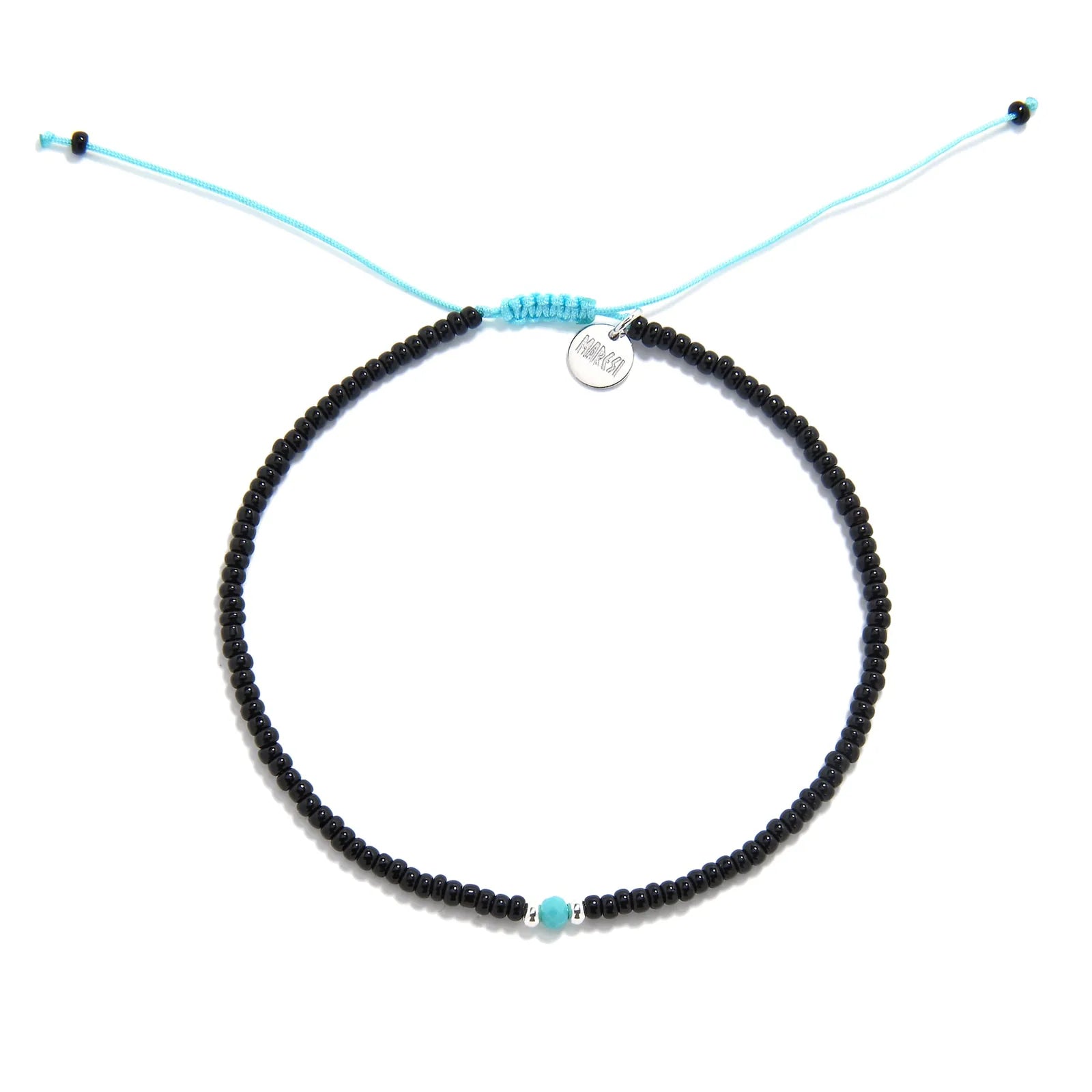 Beaded Bracelet shown from above with black seed beads with turquoise accent beads and round bracelet shape
