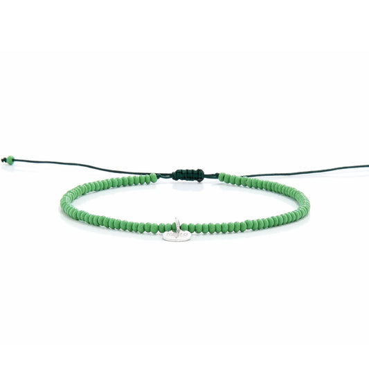 Beaded Stretch Bracelets shown in full view with green seed beads with dark green cord and adjustable cord