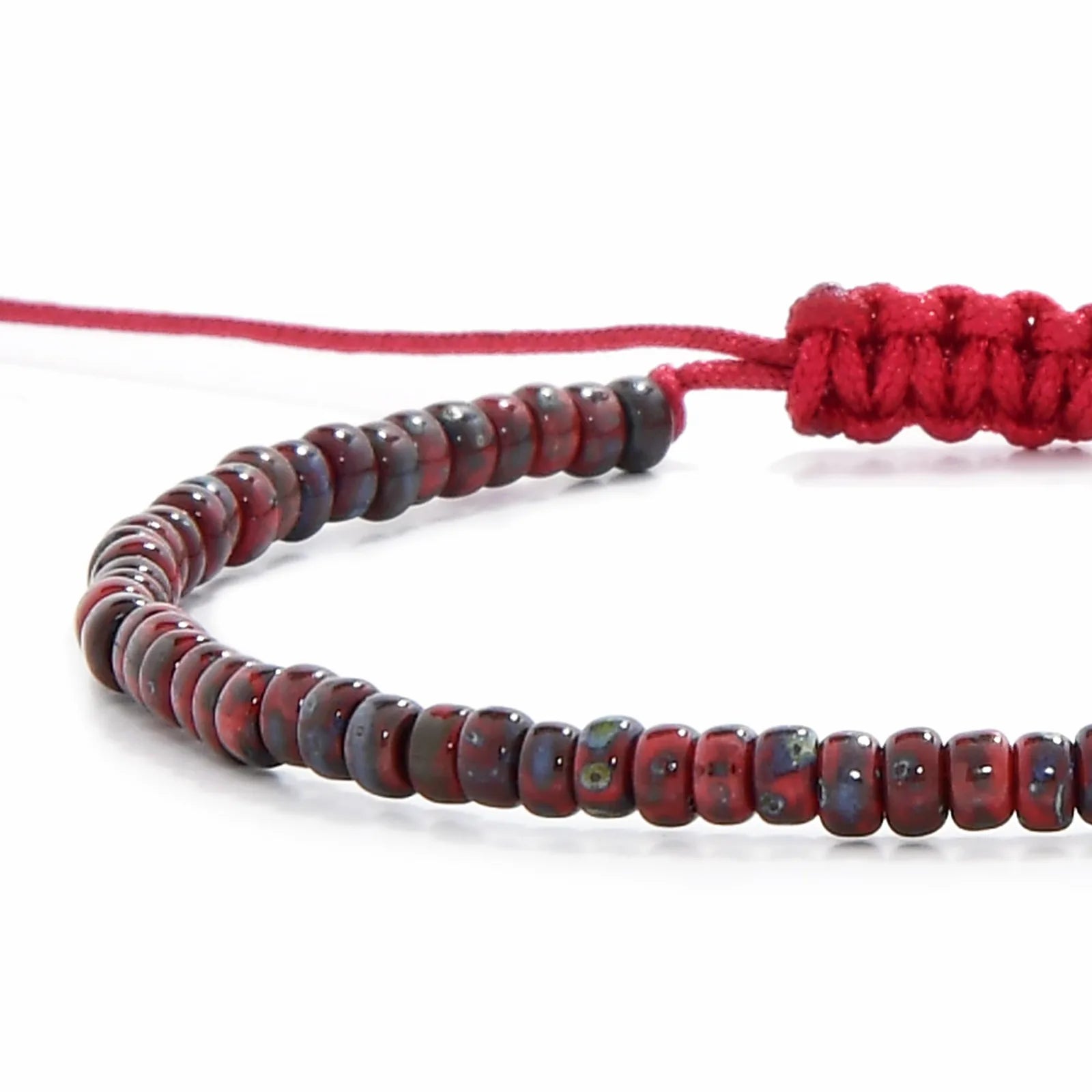 Detailed view of Beads Bracelets with red Picasso seed beads with red cord, Picasso seed bead texture, and cord knot