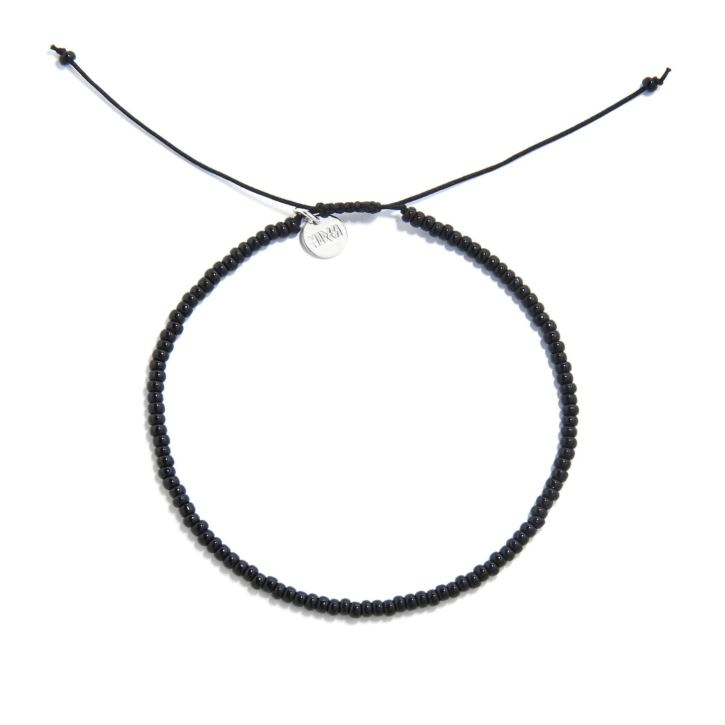 Black Bead Bracelet shown from above with black seed beads with silver charm and round bracelet shape