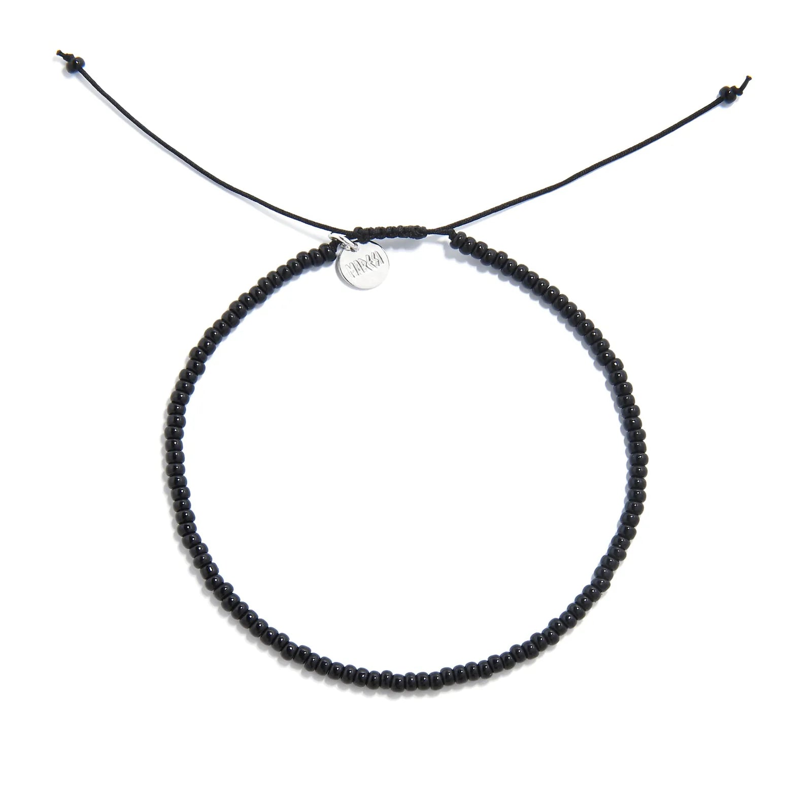 Black Bead Bracelet shown from above with black seed beads with silver charm and round bracelet shape