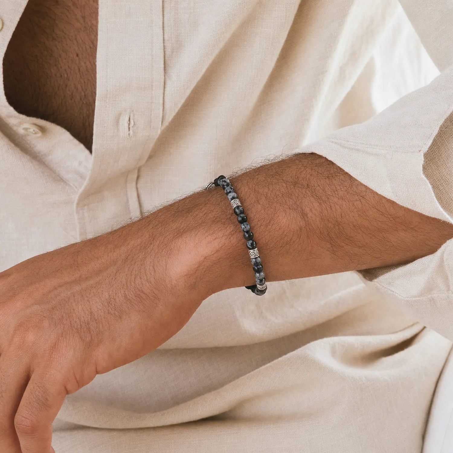 Black Stone Bracelet worn on a wrist with beaded design and adjustable cord