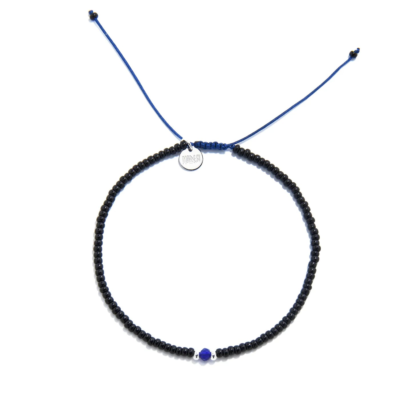 black and blue bead bracelet shown from above with black seed beads with blue accent beads and round bracelet shape