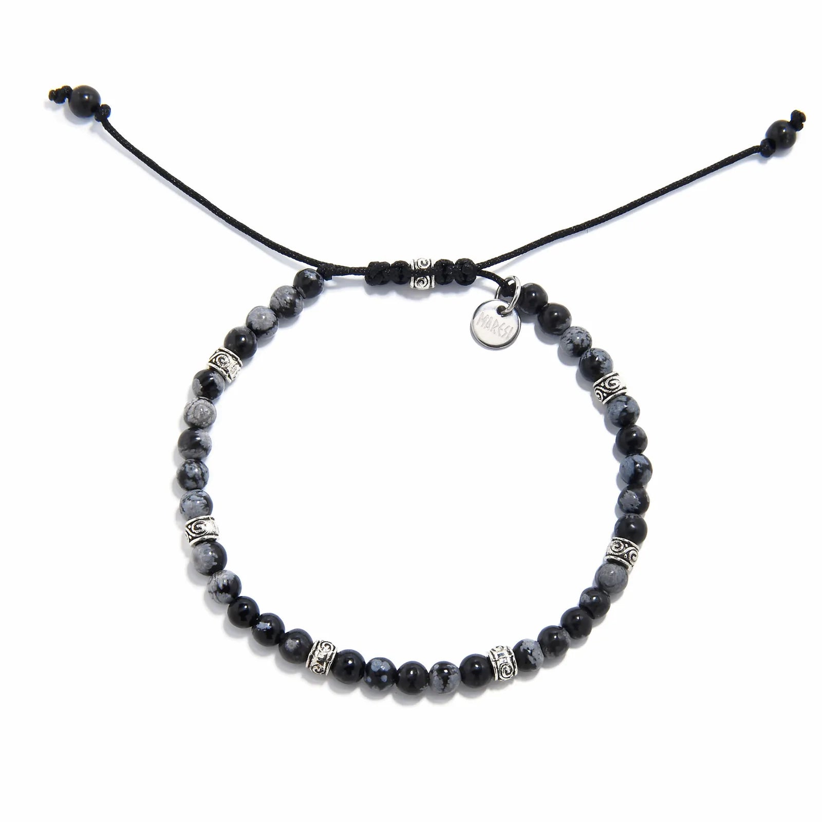Adjustable black and silver bracelet with polished jasper beads and silver detailing, laid flat.